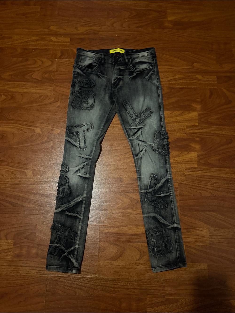 Men's Black Distressed Skinny Jeans with Patch Details
